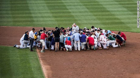 A prayer is held prior to the start of the Congressional Baseball Game at National Park in Washington, DC on June 15, 2017.