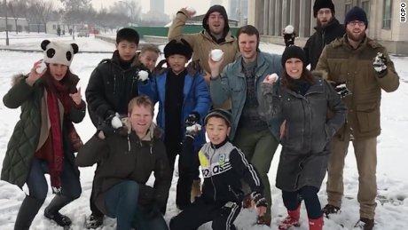 Otto Warmbier, fourth from the right in a blue jacket, throws a snowball in this photo from his trip to North Korea.