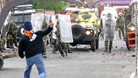 Republican protesters throw stones at British soldiers in 2002. 