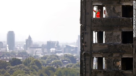 Emergency workers on the top floor of Grenfell Tower in Kensington, London, on June 17, 2017.