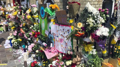 Flowers are placed outside the Notting Hill Methodist Church in west London on Sunday 18 June as a memorial to those who died in Grenfelll Tower fire. 