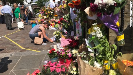 Flowers are placed outside the Notting Hill Methodist Church in west London on Sunday, June 18, as a memorial to those who died in Grenfelll Tower fire. 