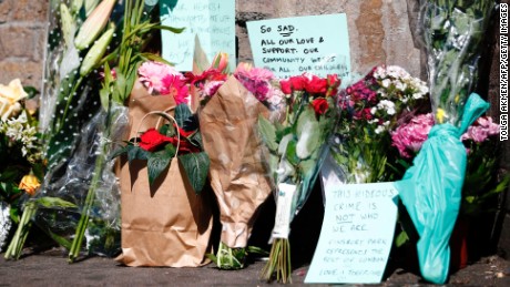 Flowers and tributes lie at a police cordon near the scene of the Finsbury Park attack.