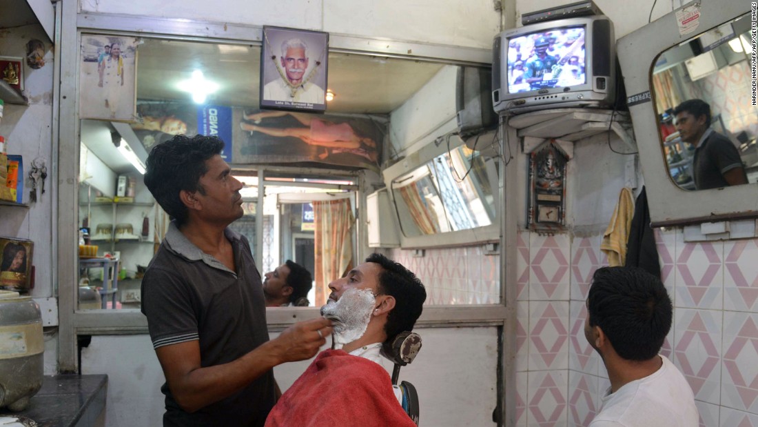 Fans watched on around the world. At a barbershop in Amrista, India fans watched the much-anticipated final in London between two great cricketing nations.