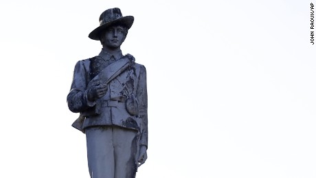 A statue of a Confederate soldier constructed in 1911 in displayed in a downtown park and will be moved to a nearby cemetery after it was decided in a hearing with supporters and protestors of the statue, Tuesday, May 16, 2017, in Orlando, Fla. (AP Photo/John Raoux)