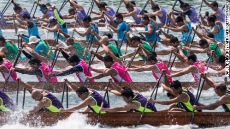 TOPSHOT - Competitors take part in a dragon boat race in Hong Kong on May 14, 2017. 
The races are part of a multi-million dollar programme of events organised to celebrate Hong Kong&#39;s 20th handover anniversary from Britain to China which falls on July 1.  / AFP PHOTO / DALE DE LA REY        (Photo credit should read DALE DE LA REY/AFP/Getty Images)
