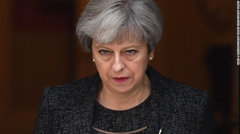 British PM faces pressure after tower fire