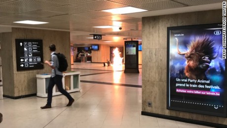 Flames are visible Tuesday night after a suitcase was detonated in Brussels Central Station.