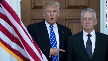 Donald Trump welcomes retired United States Marine Corps general James Mattis as they pose for a photo before their meeting at Trump International Golf Club, November 19, 2016 in Bedminster Township, New Jersey. 