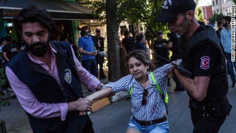 ISTANBUL, TURKEY - JUNE 25:  A woman is arrested by police after gathering to support the LGBT Pride March on June 25, 2017 in Istanbul, Turkey. The 2017 LGBT Pride March was banned by authorities for the third year. Organisers defied the order and people attempted to march to Taksim Square but were met by a heavy police presence and the crowd was dispersed by tear gas and several people were arrested.  (Photo by Chris McGrath/Getty Images)