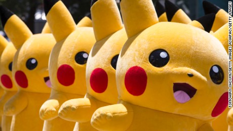 YOKOHAMA, JAPAN - AUGUST 07:  (EDITORIAL USE ONLY) Performers dressed as Pikachu, a character from Pokemon series game titles, march during the Pikachu Outbreak event hosted by The Pokemon Co. on August 7, 2016 in Yokohama, Japan. A total of 1, 000 Pikachus appear at the city&#39;s landmarks in the Minato Mirai area aiming to attract visitors and tourists to the city. The event will be held through Aug. 14.  (Photo by Tomohiro Ohsumi/Getty Images)