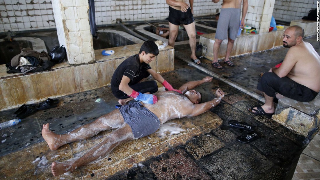 Iraqis visit a bath house on the southern outskirts of Mosul on Wednesday, April 5.