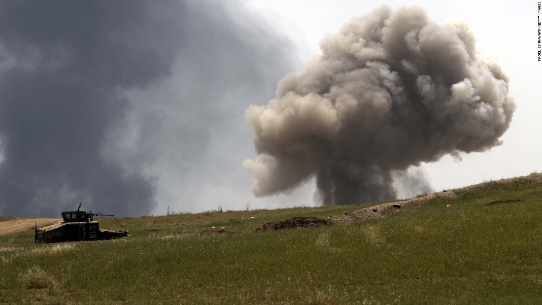 A smoke cloud rises on the front line as the Iraqi Emergency Response Division advances in west Mosul on Saturday, May 6.