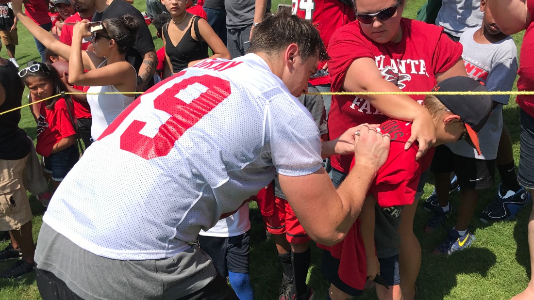 Gray was signed by the NFL&#39;s Atlanta Falcons in May 2017 having never played a game of American football. He&#39;s pictured signing a fan&#39;s shirt at a pre-season mini-camp. 
