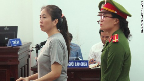 Vietnamese blogger Nguyen Ngoc Nhu Quynh, left, also known as 'Mother Mushroom,' stands trial at a courthouse in the central city of Nha Trang on June 29, 2017.