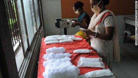 Members of Self Employed Women&#39;s Association (SEWA) make low cost sanitary pads at their facility in Ahmedabad on September 3, 2012.  