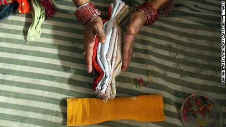NGOs and aid workers help women make clean and cheap sanitary napkins.