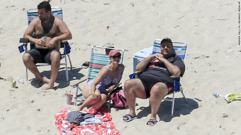 New Jersey Gov. Chris Christie uses the beach with his family and friends at the governor's summer house at Island Beach State Park in New Jersey on July 2. Christie is defending his use of the beach, closed to the public during New Jersey's government shutdown, saying he had previously announced his vacation plans and the media had simply &quot;caught a politician keeping his word.&quot;