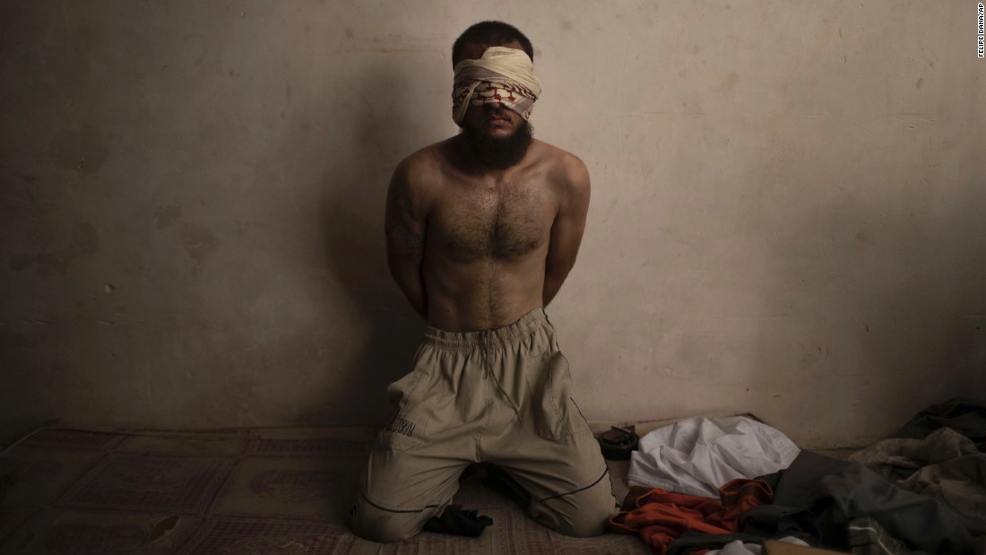 A suspected ISIS fighter is held in a basement while Iraqi forces continue to push for control of the Old City of Mosul on Monday, July 3.