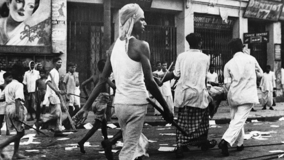  Armed rioters walk through the streets of Calcutta, now known as Kolkata, in August, 1946.  

Communal violence between Hindus and Muslims broke out during Direct Action Day, called by the Muslim League as a day of strikes, although it was open to different interpretations. The violence lasted for days and it is estimated that at least 4,000 died in Kolkata.