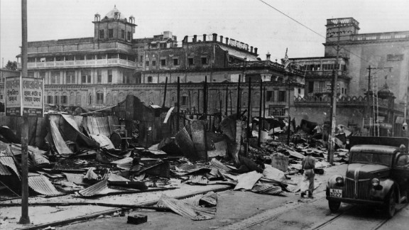 Burnt-out shops line a street after the Hindu-Muslim rioting in Kolkata on August 28, 1946.