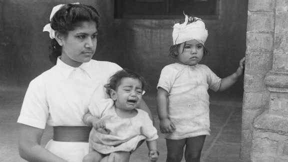 A nurse with two children who were rescued and taken to a hospital during communal unrest in Amritsar, Punjab, north India, in March 1947.