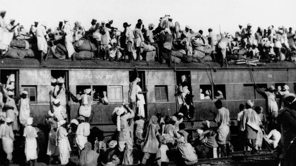 Hundreds of Muslim refugees crowd on top of a train leaving New Delhi for Pakistan in September 1947. 

Partition led to millions being forced to migrate across the subcontinent. It