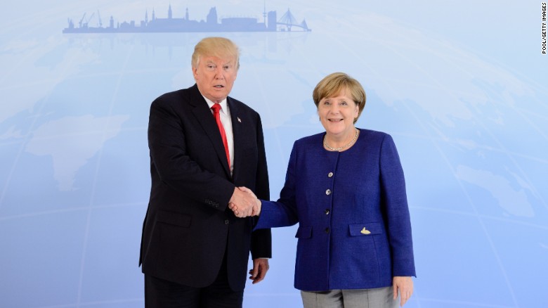 Image result for angela merkel shaking hands