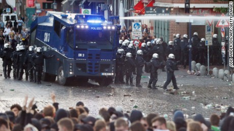 Riot police use water cannon during the &quot;Welcome to Hell&quot; rally against the G20 summit in Hamburg, northern Germany on July 6, 2017. 