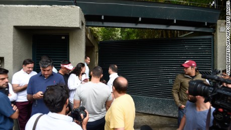 Journalists and supporters of Venezuelan opposition leader Leopoldo Lopez gather outside his house in Caracas, after he was released from prison and placed under house arrest for health reasons, on July 8, 2017.
Venezuela's Supreme Court confirmed on its Twitter account it had ordered Lopez to be moved to house arrest, calling it a "humanitarian measure" granted on July 7 by the court's president Maikel Moreno. "Leopoldo Lopez is at his home in Caracas with (wife) Lilian and his children," Lopez's Spanish lawyer Javier Cremades said in Madrid. "He is not yet free but under house arrest. He was released at dawn." / AFP PHOTO / Juan BARRETO        (Photo credit should read JUAN BARRETO/AFP/Getty Images)