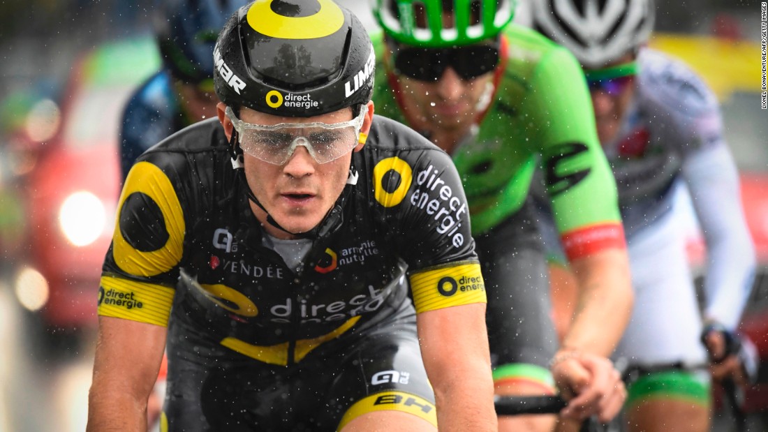 France&#39;s Thomas Boudat rides in the rain in a breakaway during the second stage of the 104th edition of the Tour de France.