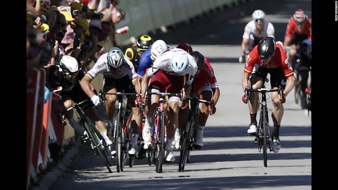 Peter Sagan (2-L) of Slovakia flicks his elbow towards Team Dimension Data rider Mark Cavendish (L) during the final sprint of the fourth stage. Sagan was subsequently disqualified from the Tour, before making an unsuccessful appeal to CAS. Cavendish suffered an injured shoulder which ended his hopes of overtaking Eddy Merckx as the Tour&#39;s most prolific stage winner.
