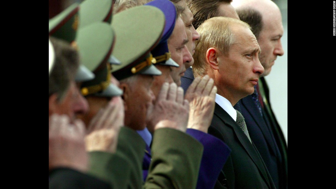 Putin watches honor guards march at the Tomb of the Unknown Soldier during a wreath-laying ceremony in Moscow in June 2003.