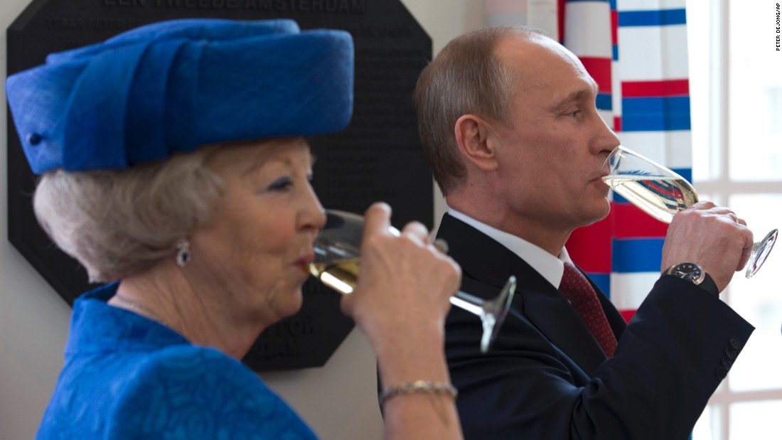 Putin and Dutch Queen Beatrix share a toast after unveiling a plaque at the Hermitage Amsterdam museum in April 2013. It&#39;s a branch of the Hermitage Museum in St. Petersburg.