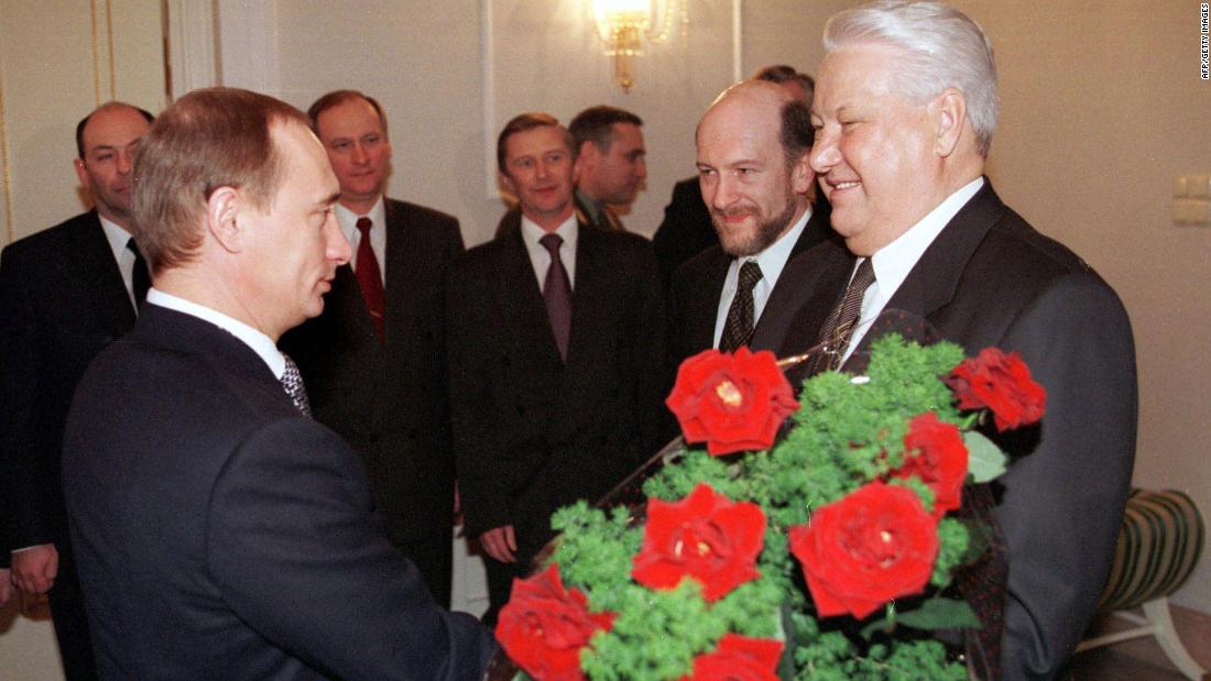 Putin rose quickly through the political ranks. Here, he gives flowers to Russian President Boris Yeltsin during a farewell ceremony in Moscow in December 1999. Yeltsin, Russia&#39;s first democratically elected president, was resigning from office. Putin, his prime minister, was appointed acting president until the election, which Putin won several months later.