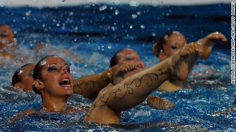 Members of the Hungarian synchronized swimming team perform during halftime of the Water Polo European Championships match between Hungary and Spain.
