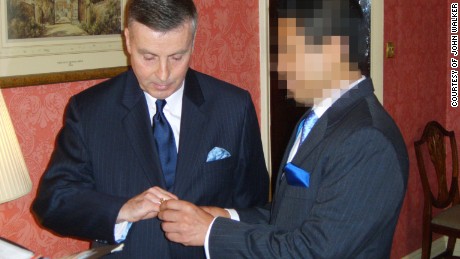 John Walker and his then partner at their civil partnership ceremony in 2006. This image, obtained by CNN, was originally blurred by Walker in order to protect the identity of his husband.