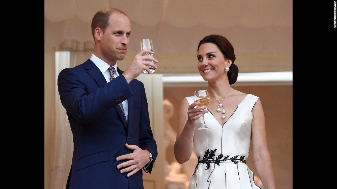 William and Kate make a toast during a Queen&#39;s birthday party in Poland.