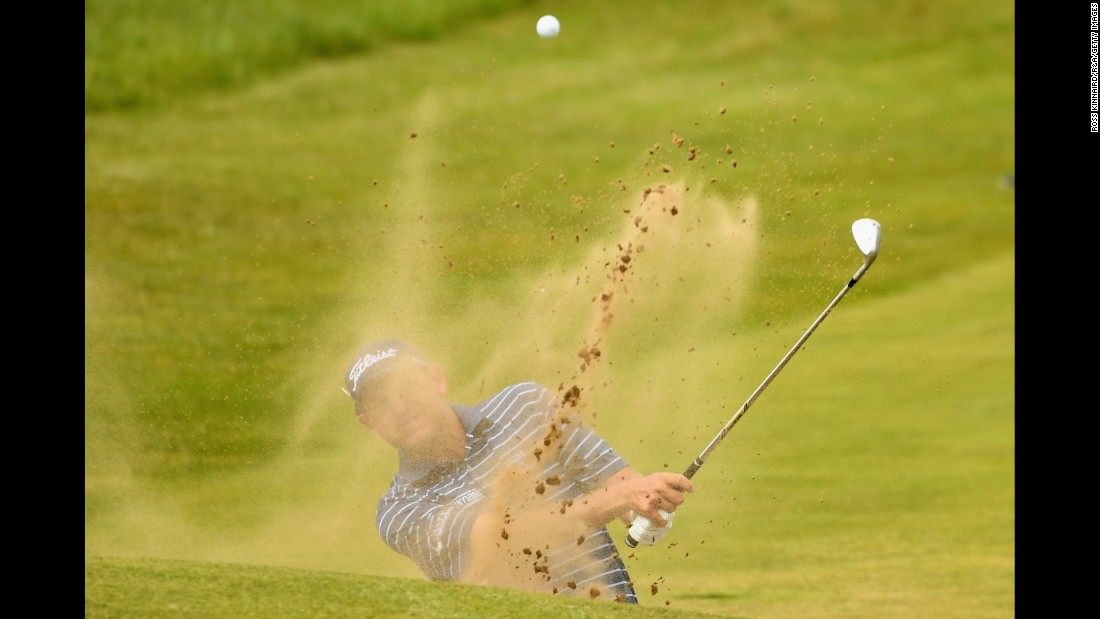 Bill Haas of the United States tied for ninth at last year&#39;s Open. He is pictured here hitting from a bunker during practice.
