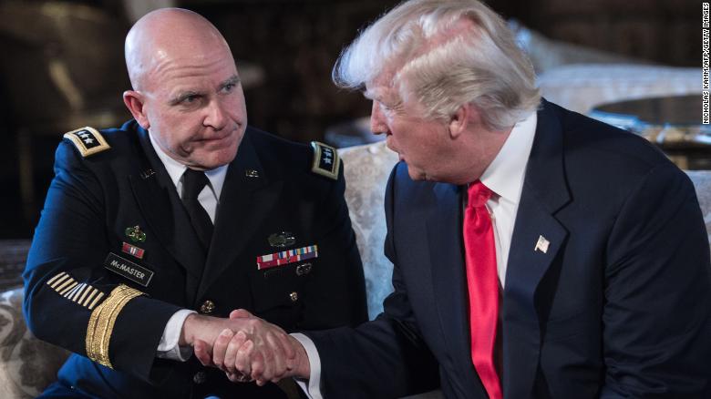 US President Donald Trump shakes hands with US Army Lieutenant General H.R. McMaster (L) as his national security adviser at his Mar-a-Lago resort in Palm Beach, Florida, on February 20, 2017. / AFP / NICHOLAS KAMM (Photo credit should read NICHOLAS KAMM/AFP/Getty Images)