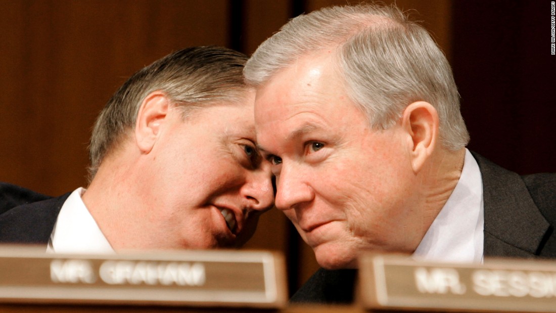 Sessions and Sen. Lindsey Graham, R-South Carolina, confer during a Judiciary Committee confirmation hearing for Alberto R. Gonzales in January 2005. President George W. Bush nominated Gonzales to be  attorney general.