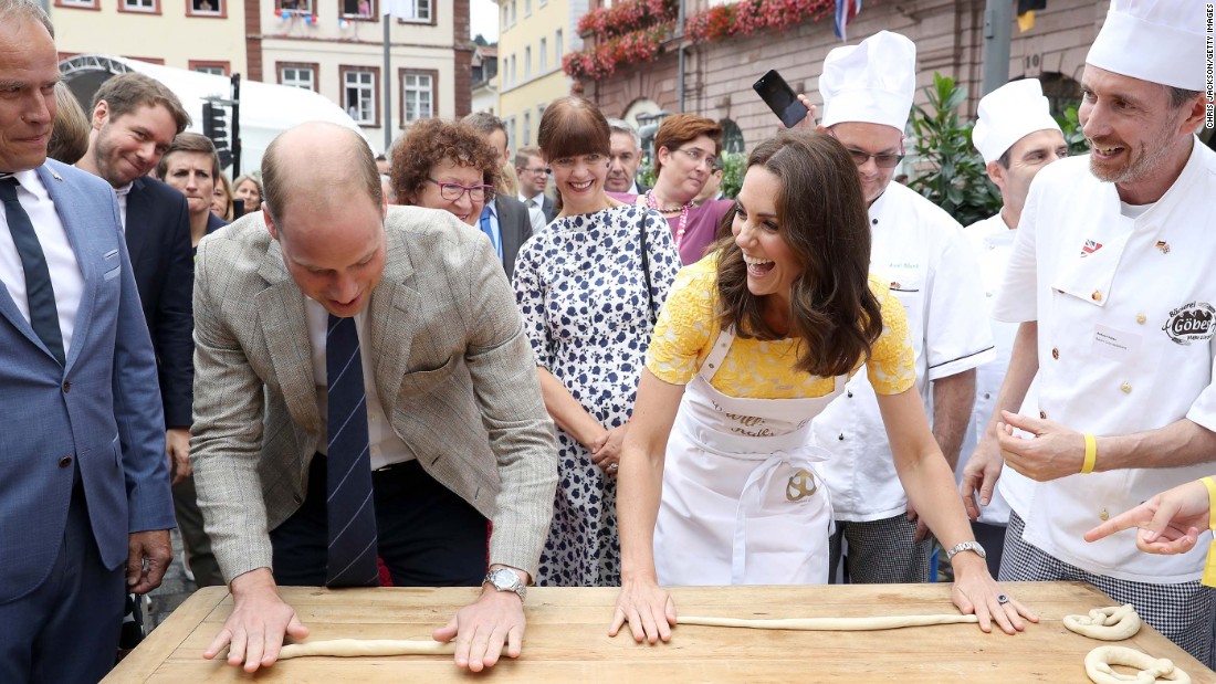 William and Kate attempt to make pretzels on July 20, during a tour of Heidelberg&#39;s traditional German market.