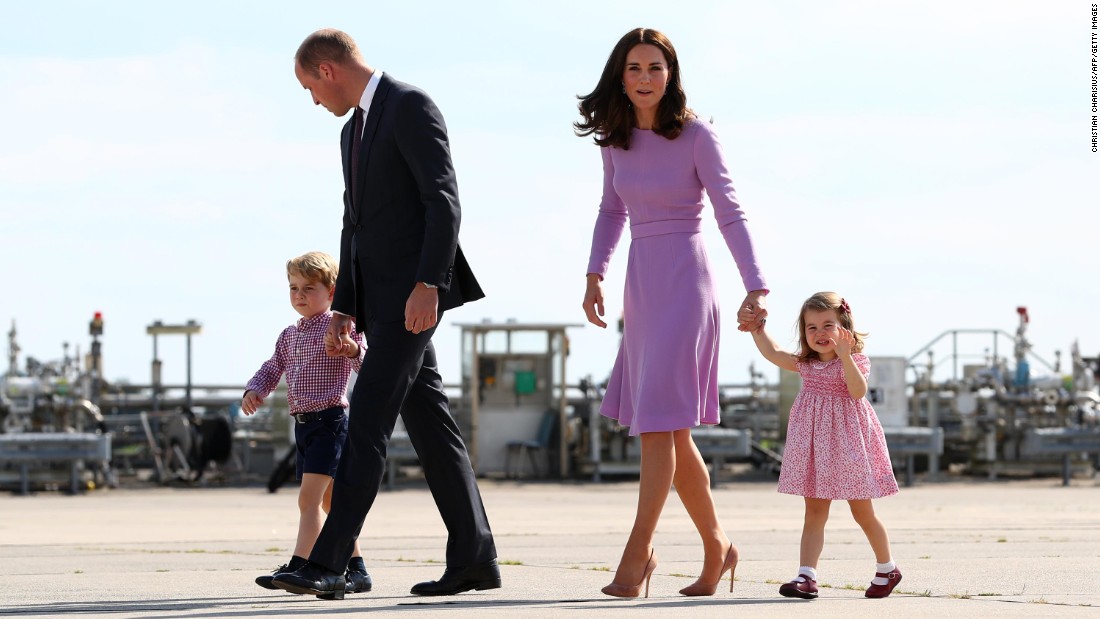 Britain&#39;s Prince William, Duke of Cambridge, and his wife Catherine, Duchess of Cambridge, and their children Prince George and Princess Charlotte walk on the tarmac of the Airbus compound in Hamburg, northern Germany, before boarding their plane on Friday, July 21. The royal family visited Germany and Poland on a five-day European tour.