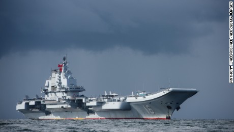 China&#39;s first aircraft carrier, Liaoning, arrives in Hong Kong waters on July 7, 2017.