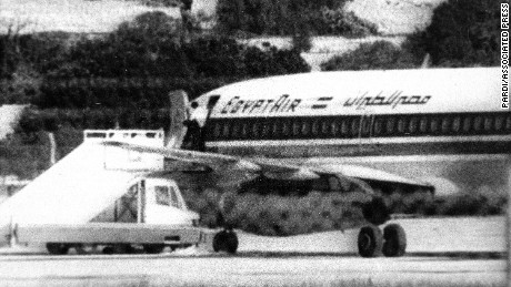 One of the three hijackers of EgyptAir flight 648 appears at the open doorway at Luqa airport in Valletta, Malta, Nov. 24, 1985.  The jet bound for Athens was diverted to Malta on Nov. 23 by the Abu Nidal Group.  (AP Photo/Pardi)