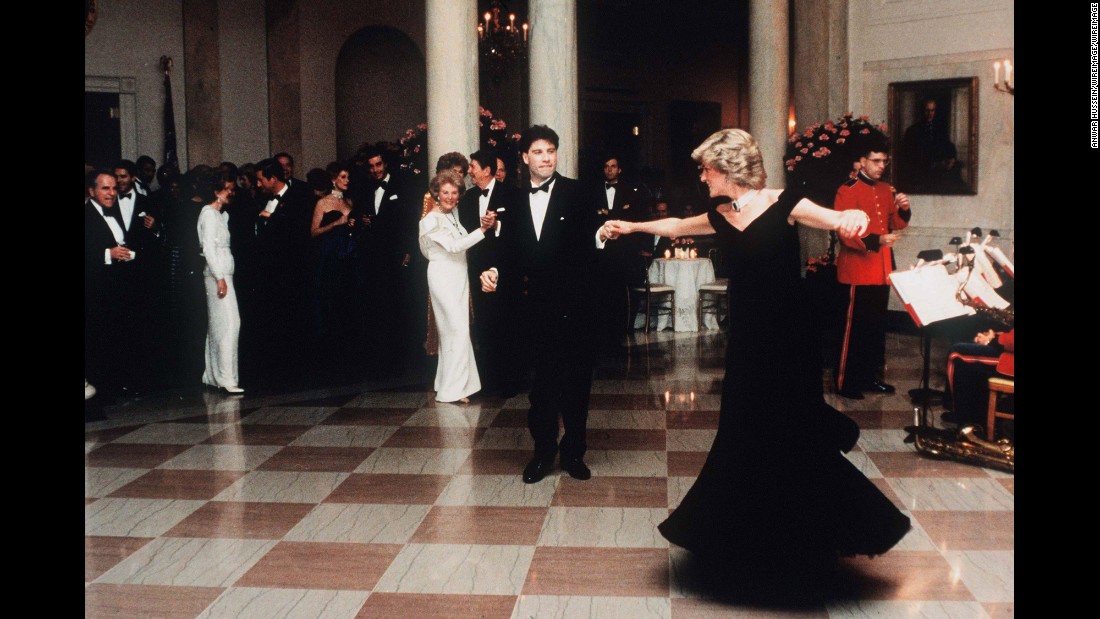 Diana dances with actor John Travolta at the White House in November 1985. Dancing behind Travolta are US President Ronald Reagan and first lady Nancy Reagan. A few years ago, Diana&#39;s blue velvet dress -- nicknamed the &quot;Travolta dress&quot; -- was auctioned for 240,000 British pounds ($362,424 US).