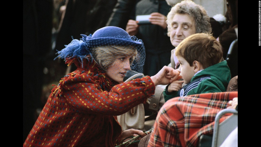 Diana greets a child while visiting Wrexham, Wales, in November 1982.