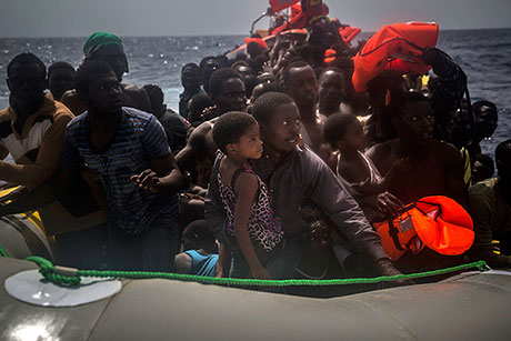 Migrants wait to be rescued by aid workers of Spanish NGO Proactiva Open Arms in the Mediterranean.