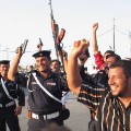 Iraqi police celebrate football guns