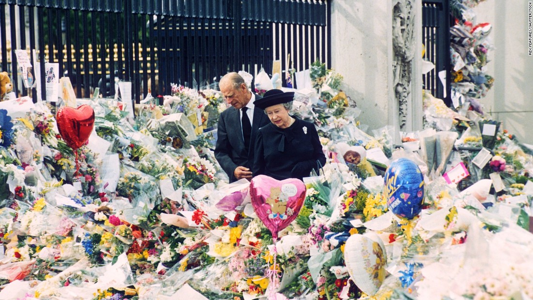 On the eve of Diana&#39;s funeral, the Queen and Prince Philip look at floral tributes left outside Buckingham Palace. More than 1 million bouquets of flowers were left at Kensington Palace, Buckingham Palace and St. James&#39;s Palace in the wake of Diana&#39;s death.